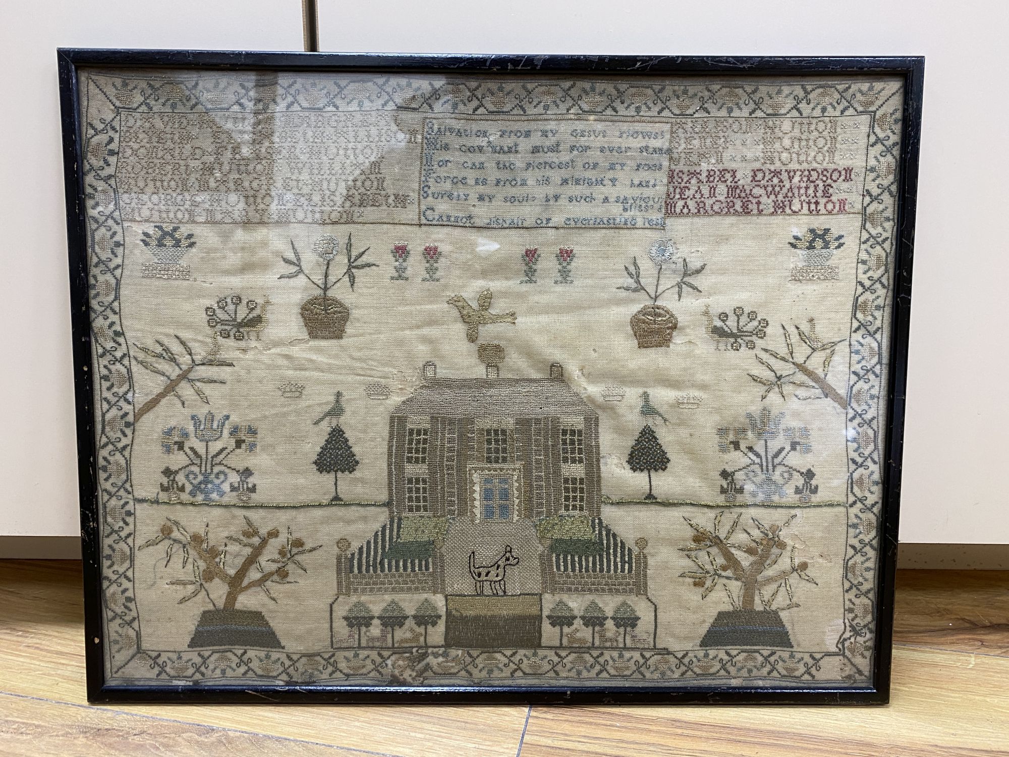 A late Georgian Hutton family sampler depicting house and garden